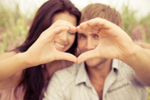 Couple making a heart shape 