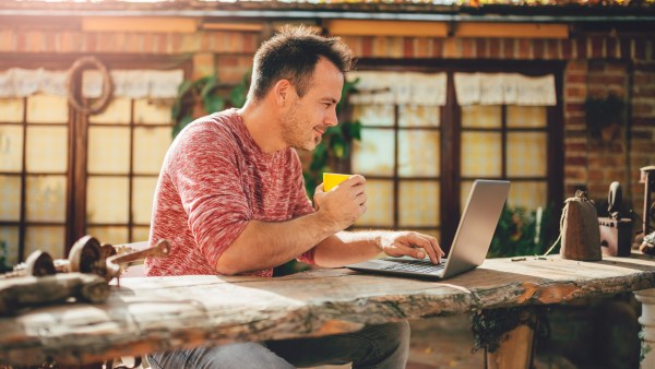 Man working outdoors with exotic background.