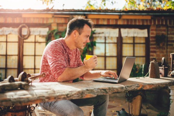 Man working outdoors with exotic background.