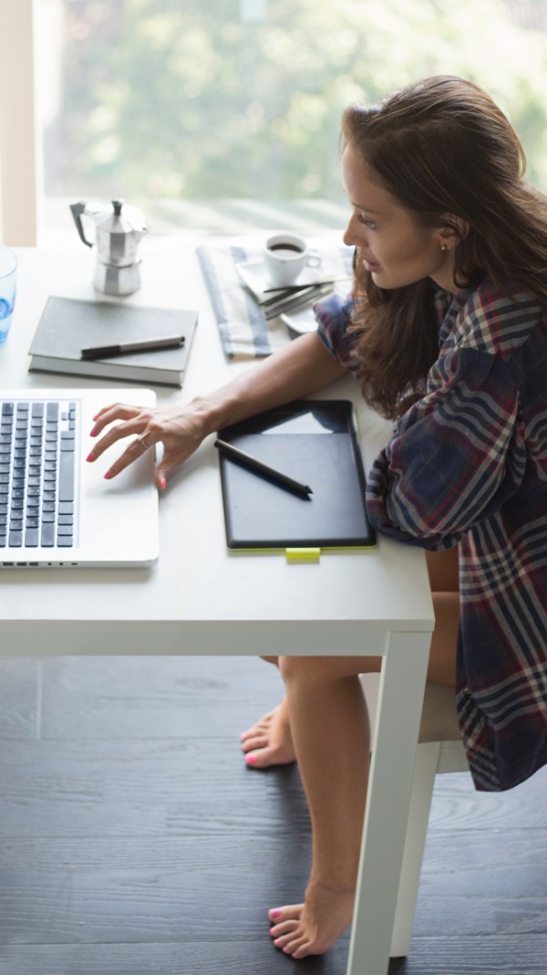 Woman looking for tax help on laptop computer