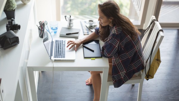 Woman looking for tax help on laptop computer