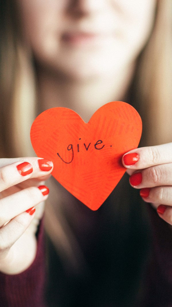 Girl holding giving heart