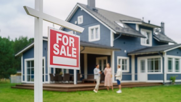 House with a for-sale sign outside
