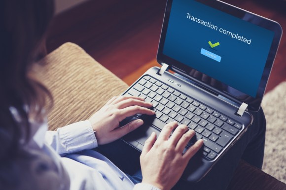 Laptop screen that says “Transaction completed”