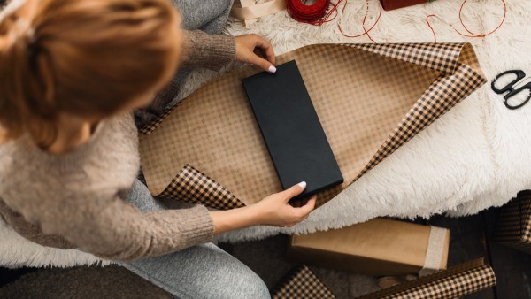 woman wrapping a gift