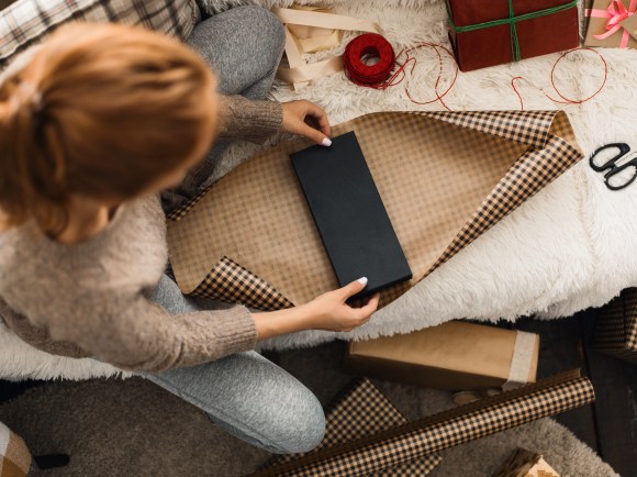 woman wrapping a gift