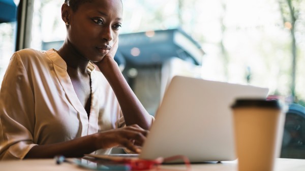 Woman reading about W-4 withholding certificate