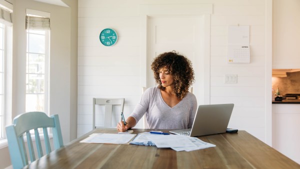 Woman calculating adjusted gross income