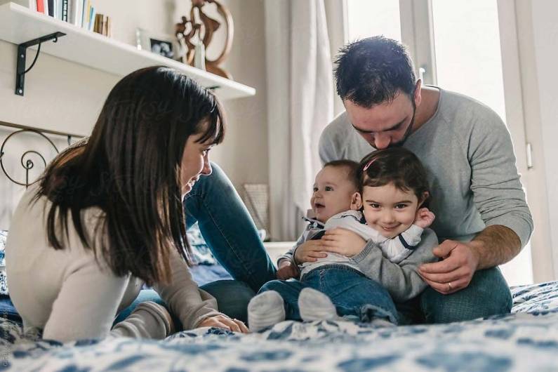 Parents with a young child and a baby