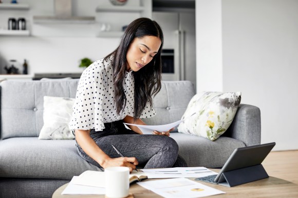 woman sitting with paper