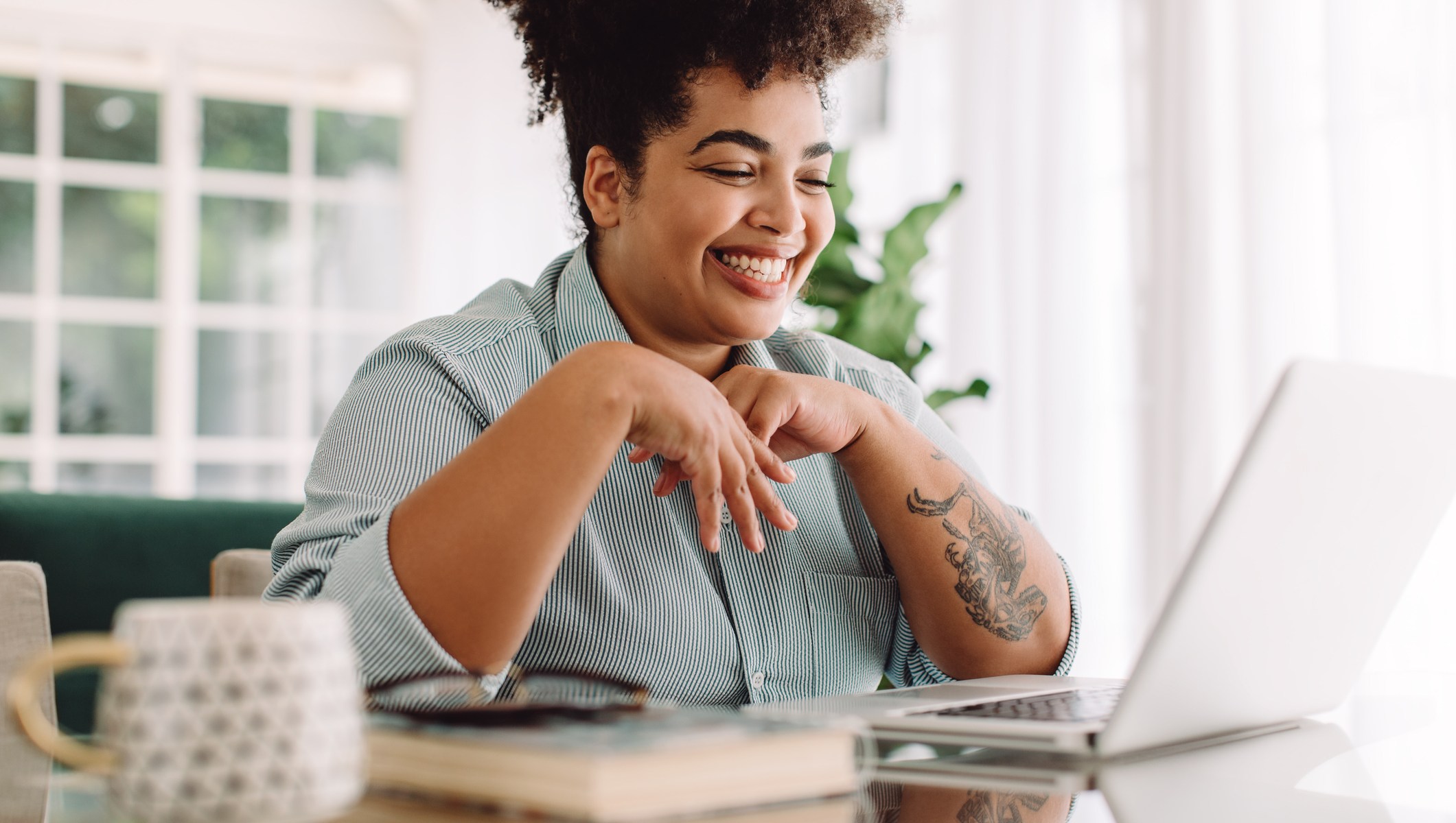 positive woman on computer