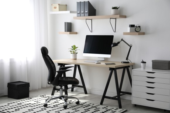 Image of a black and white home office setup.
