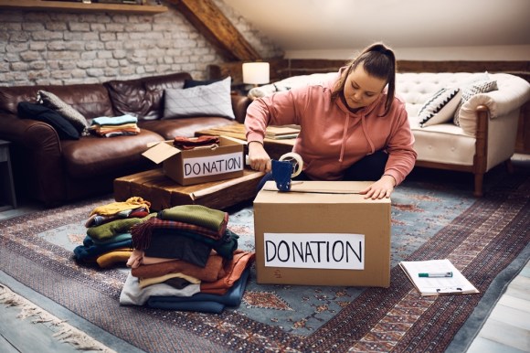 Woman boxing up donations.