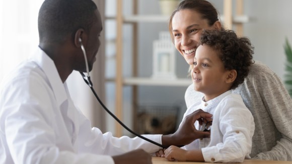 Young mother and her son at the doctor.