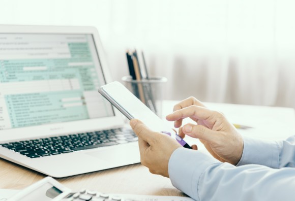 Close-up of a person doing taxes.