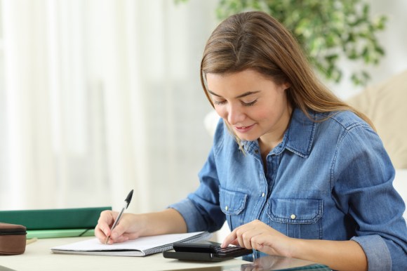 Woman using a calculator.