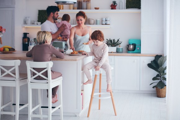 Family of five eating breakfast.