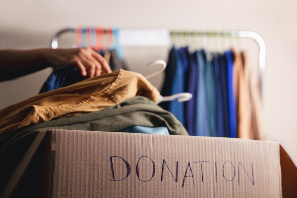 Packing box of clothes for donation.