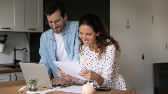 Couple reviewing documents together.