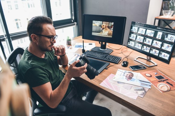 Photographer working at a desk.