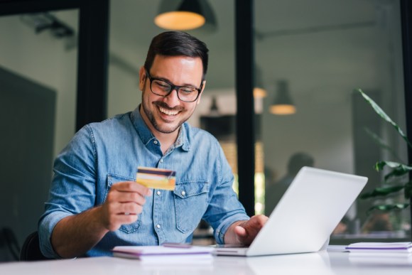 Man making a payment online with credit card.