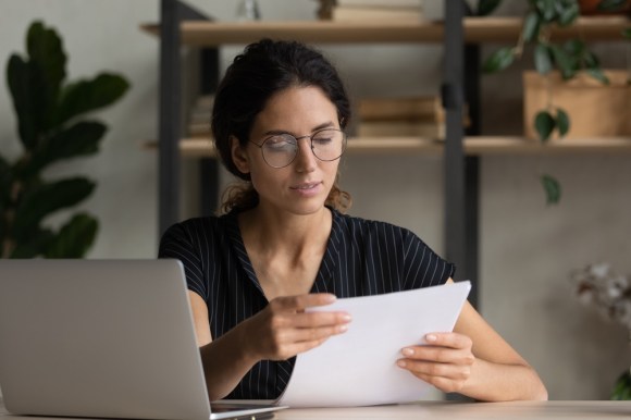 Woman reading document.