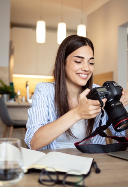Female photographer working at her desk