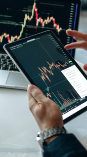 Modern investing on a laptop and tablet